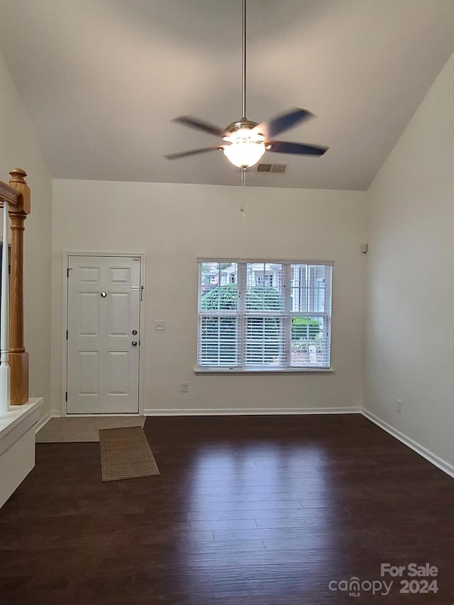 entrance foyer with vaulted ceiling, dark hardwood / wood-style flooring, and ceiling fan