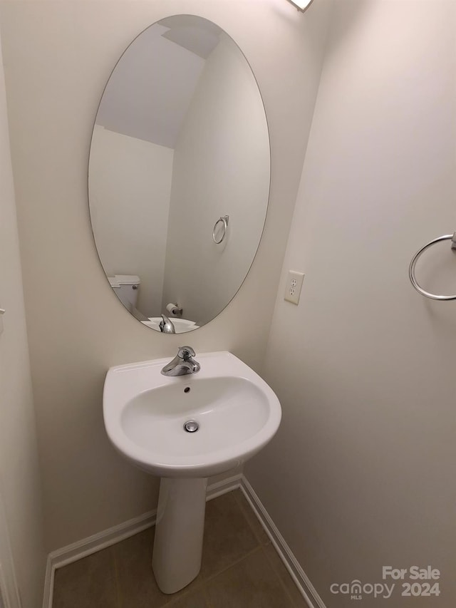 bathroom with tile patterned floors