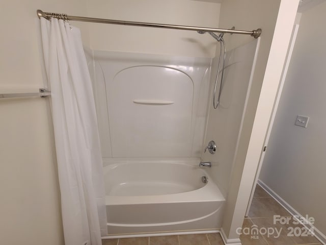 bathroom with tile patterned floors and shower / bathtub combination with curtain