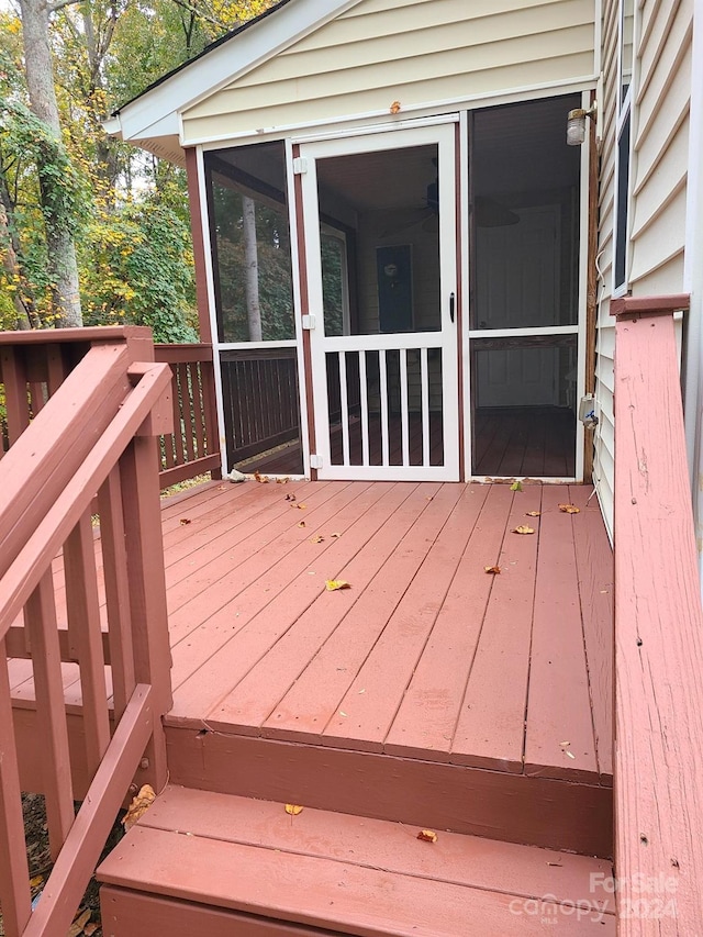 wooden terrace with a sunroom