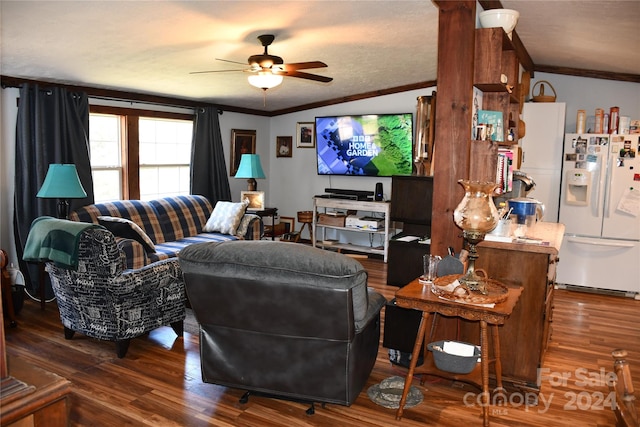 living room featuring dark hardwood / wood-style floors, ceiling fan, ornamental molding, and vaulted ceiling