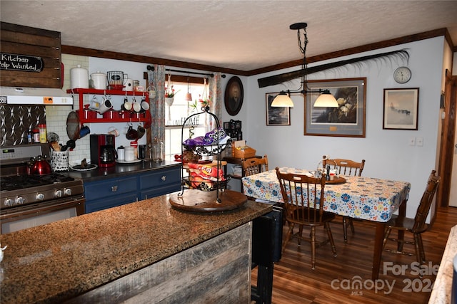 dining room featuring dark hardwood / wood-style floors, ornamental molding, and a textured ceiling