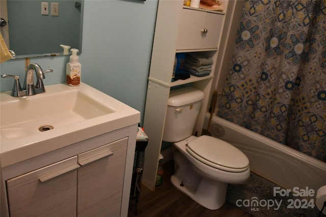 full bathroom with vanity, hardwood / wood-style floors, shower / bathtub combination with curtain, and toilet