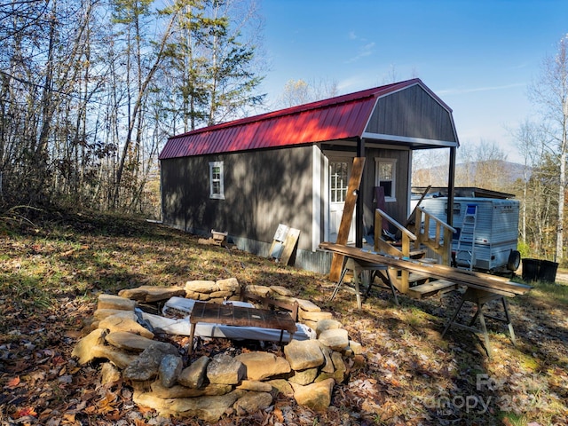 view of outdoor structure with a fire pit