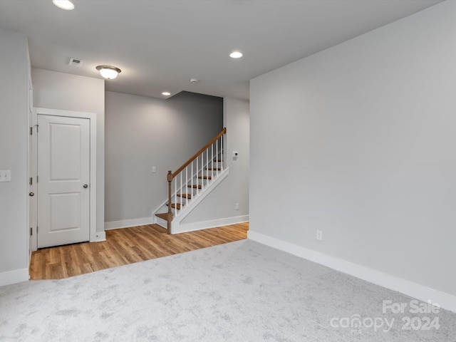 spare room featuring hardwood / wood-style floors