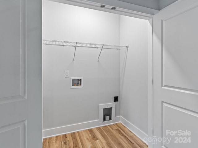 laundry room featuring hardwood / wood-style floors, electric dryer hookup, and washer hookup