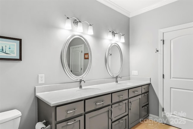 bathroom featuring toilet, vanity, crown molding, and tile patterned flooring