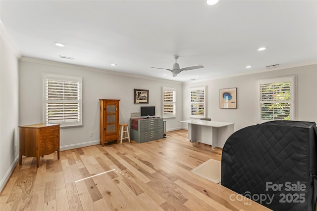 bedroom featuring multiple windows, light wood-type flooring, ceiling fan, and ornamental molding