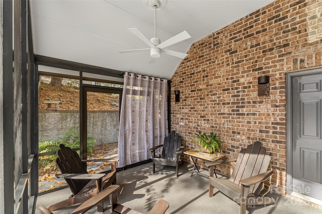 sunroom featuring lofted ceiling and ceiling fan