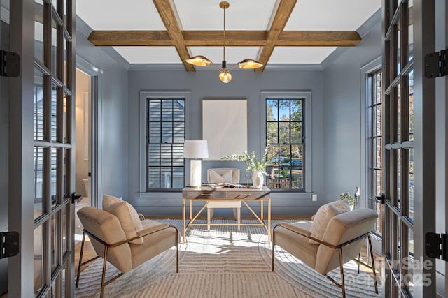 sitting room with an inviting chandelier, beam ceiling, french doors, and coffered ceiling