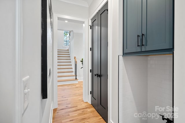 corridor featuring light hardwood / wood-style floors