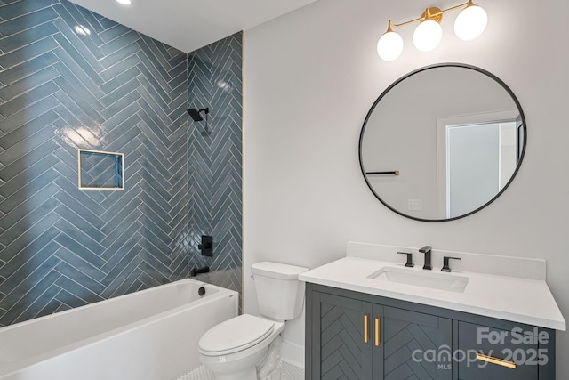 full bathroom featuring tile patterned floors, tiled shower / bath combo, vanity, and toilet