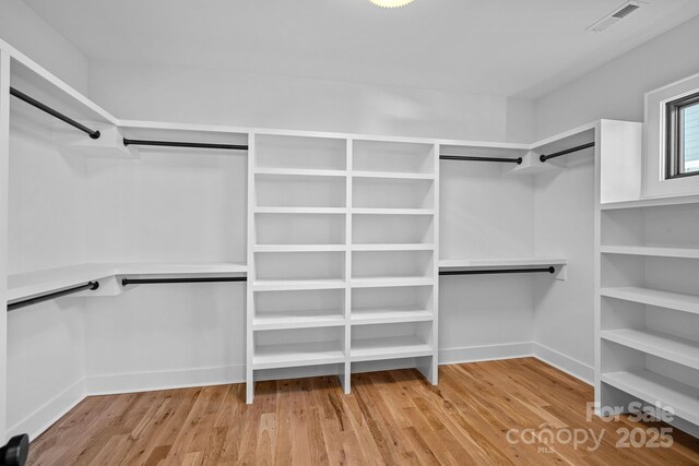 spacious closet featuring light wood-type flooring