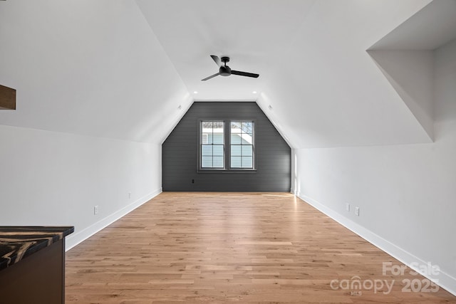 additional living space featuring ceiling fan, light hardwood / wood-style floors, and lofted ceiling