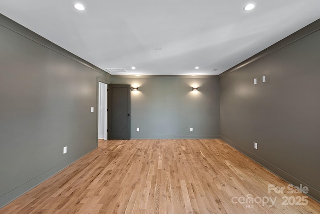 unfurnished room with crown molding and light hardwood / wood-style flooring