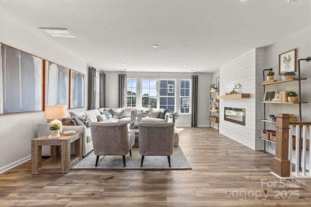 living room featuring a fireplace and hardwood / wood-style floors