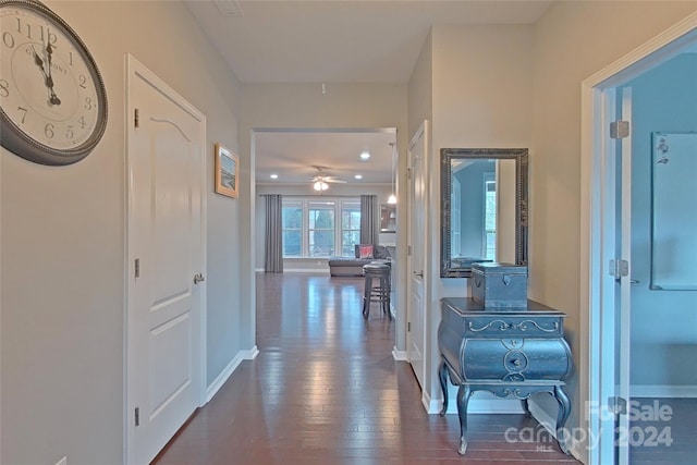 hallway with dark wood-type flooring