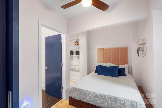 bedroom featuring ceiling fan and dark hardwood / wood-style flooring