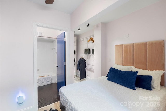 bedroom with hardwood / wood-style floors, a closet, and ceiling fan