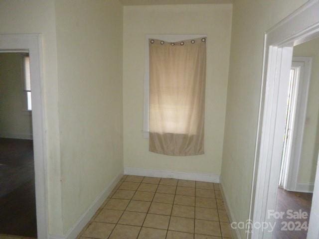 empty room with light tile patterned flooring