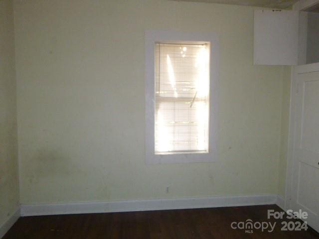 empty room featuring dark hardwood / wood-style floors