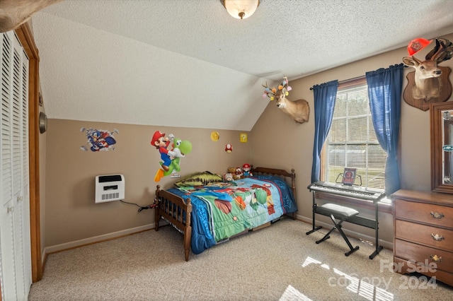 bedroom with lofted ceiling, light carpet, heating unit, a textured ceiling, and a closet