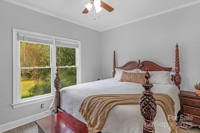 bedroom featuring crown molding, wood-type flooring, and ceiling fan