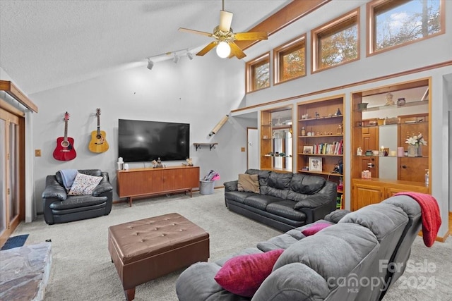 living room featuring a wealth of natural light, light carpet, and ceiling fan