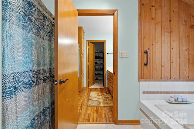 bathroom with hardwood / wood-style floors and vanity