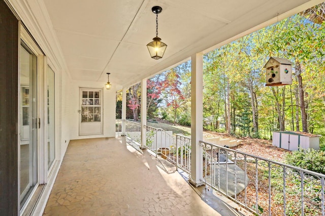 view of patio featuring a storage shed