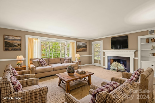 living room with crown molding and light colored carpet