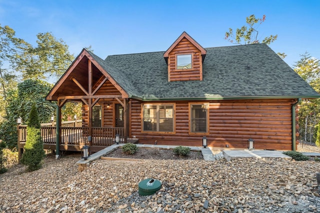 log cabin with covered porch