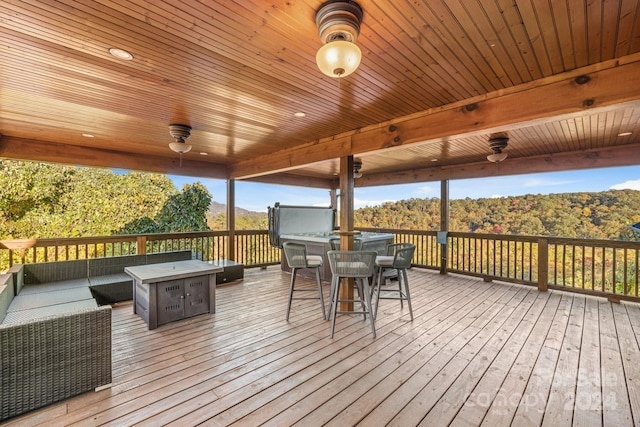 wooden terrace featuring a mountain view