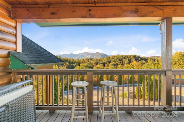 wooden terrace featuring a mountain view