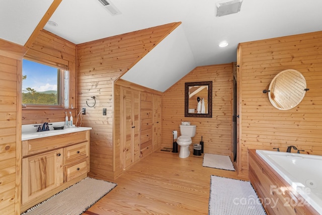 full bathroom with toilet, lofted ceiling, wood walls, and wood-type flooring