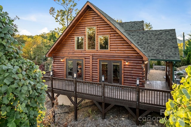 rear view of house with french doors and a deck