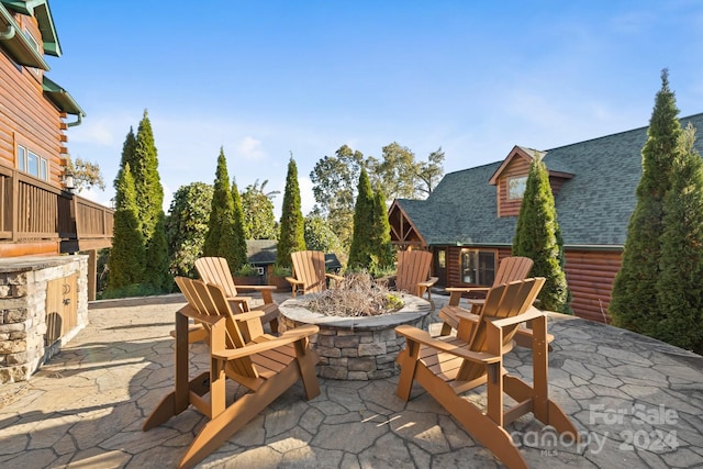 view of patio / terrace featuring an outdoor fire pit