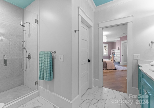 bathroom featuring hardwood / wood-style flooring, vanity, a shower with door, and crown molding