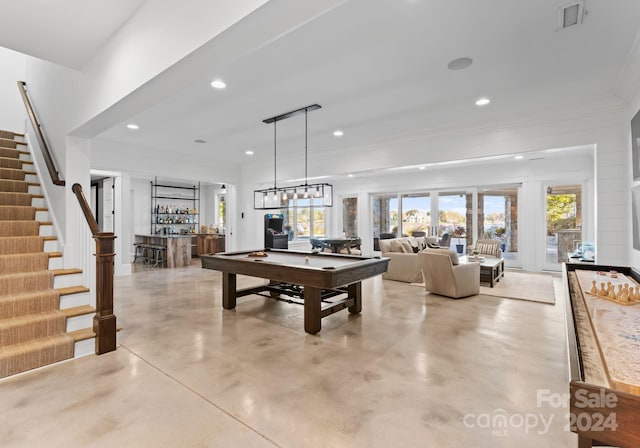 playroom with billiards and bar area