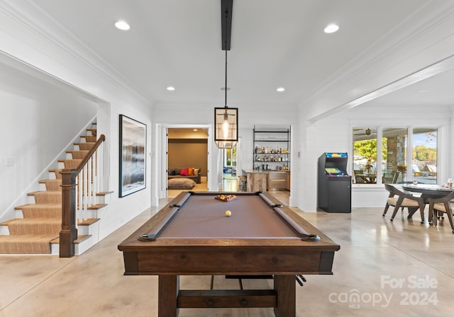 recreation room with bar area, ornamental molding, and pool table