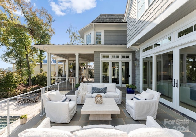 view of patio / terrace featuring outdoor lounge area, french doors, and a deck