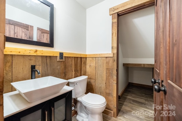 486 Hunter-Lysik Way, Laurel Springs, NC 28644 - bathroom featuring toilet, wainscoting, wood finished floors, and vanity