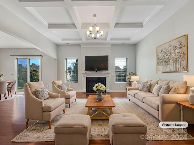 living room featuring a wealth of natural light, beamed ceiling, coffered ceiling, and light wood-type flooring