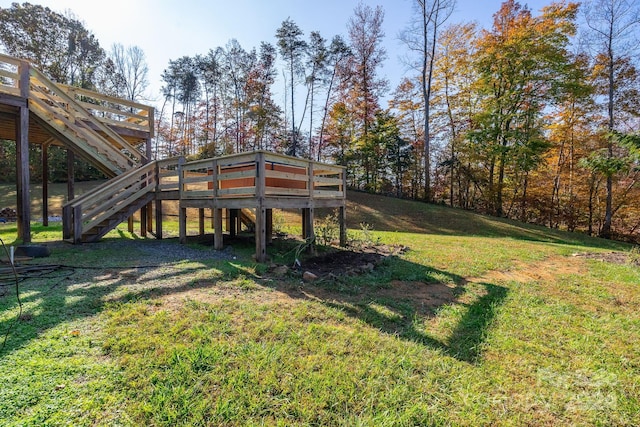 view of yard featuring a wooden deck and stairs