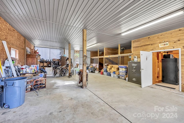 garage with black refrigerator