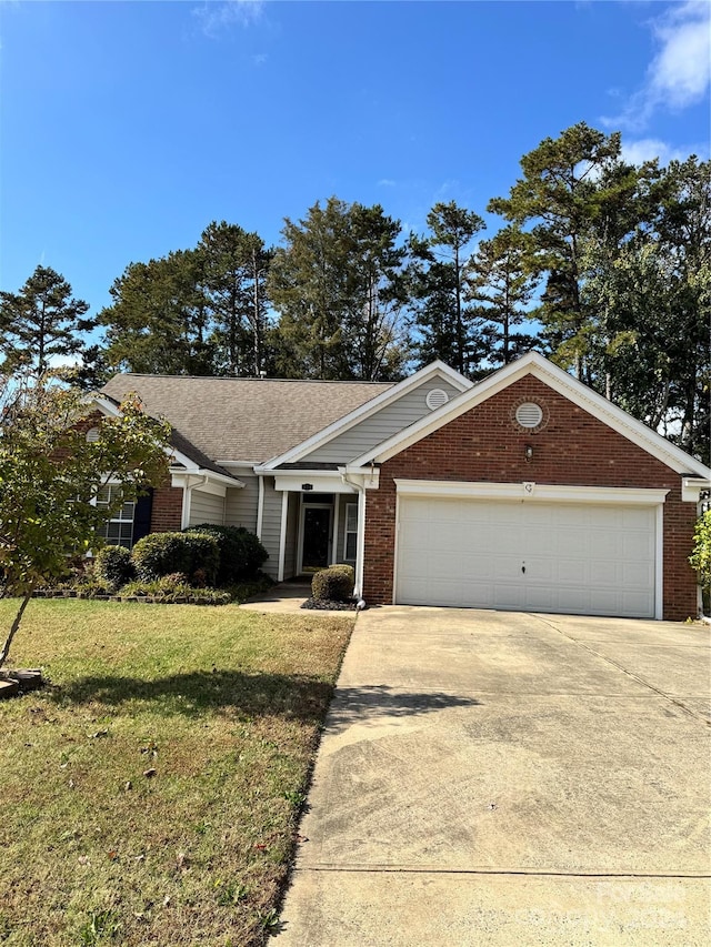 ranch-style home with a front lawn and a garage