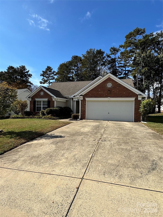 single story home with a front yard and a garage