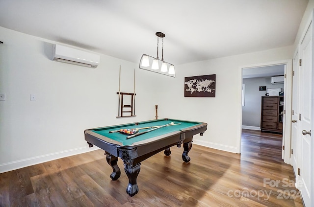 rec room featuring a wall mounted air conditioner, wood-type flooring, and billiards