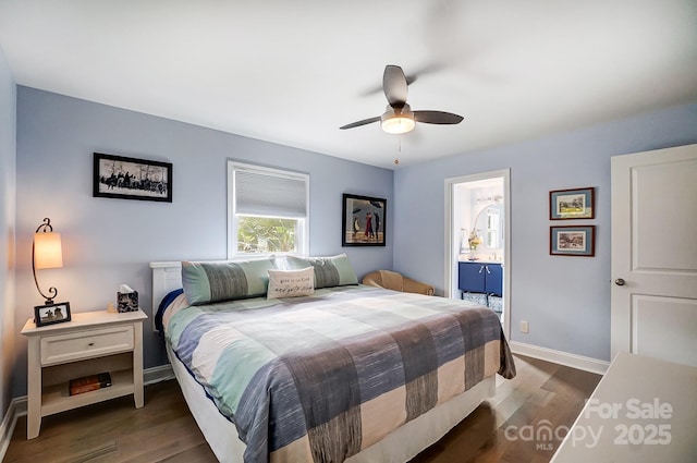 bedroom featuring ceiling fan, wood finished floors, ensuite bathroom, and baseboards