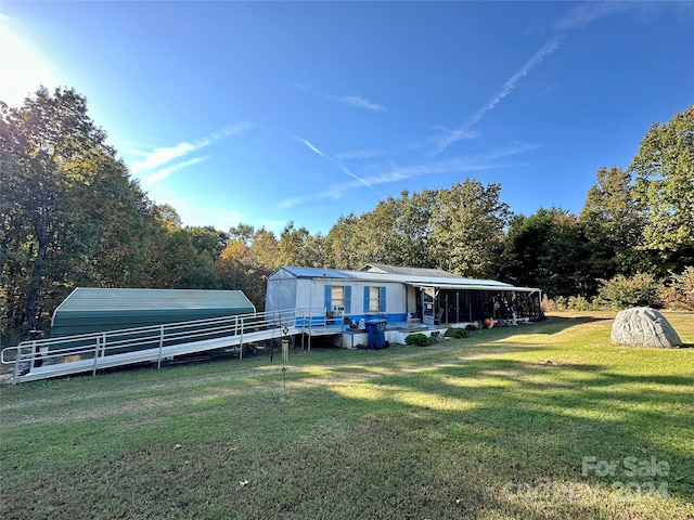 back of house featuring a yard